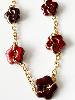 Collier fleurs prune bordeaux doré