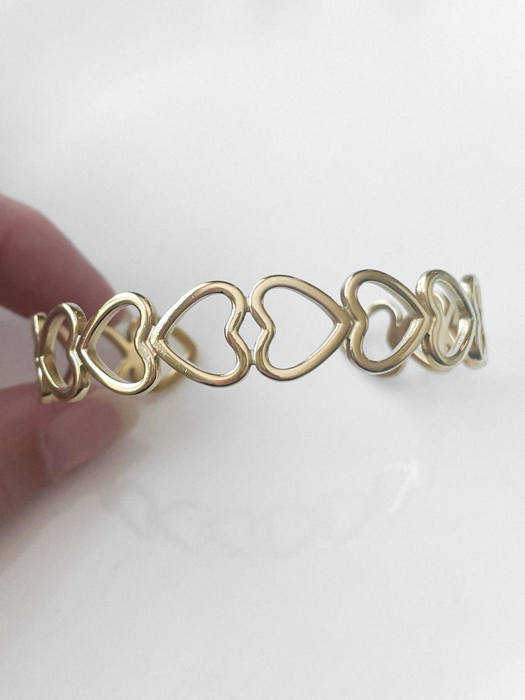 Bracelet manchette coeurs doré