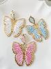 boucles papillon blanc doré