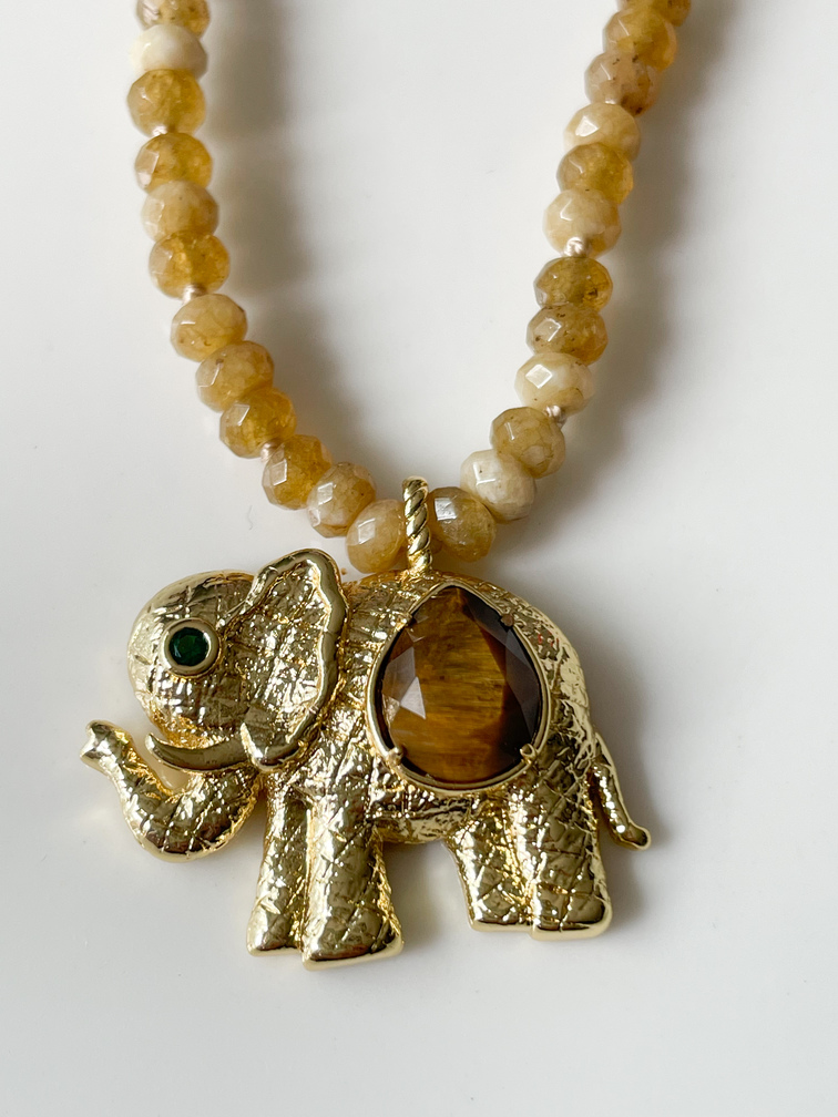 Collier éléphant pierres ocre doré