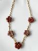 Collier fleurs rose prune doré