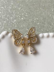 Boucles papillon doré