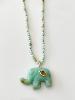 Collier éléphant pierres turquoise doré