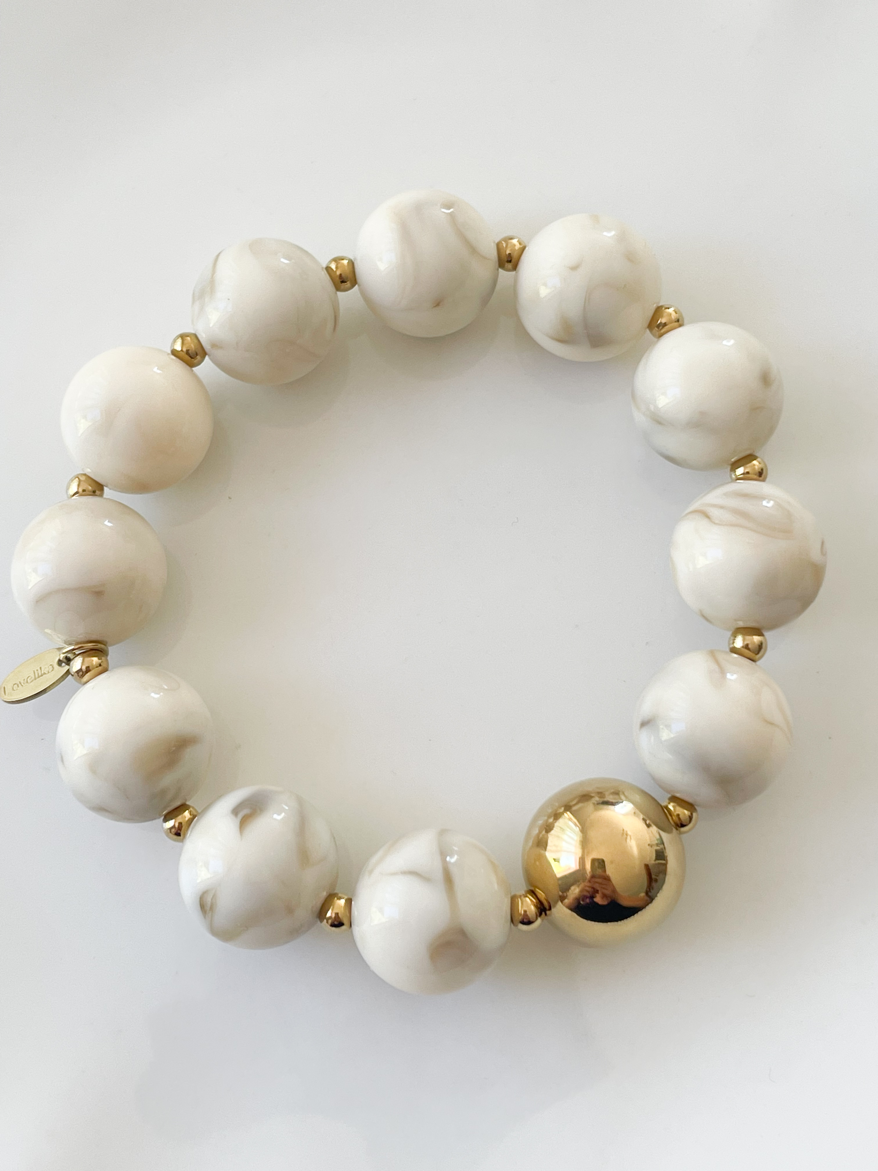 Bracelet boules beige doré