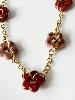 Collier fleurs rose prune doré