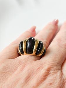 Bague noire doré