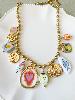 Collier breloques coeur ex voto doré