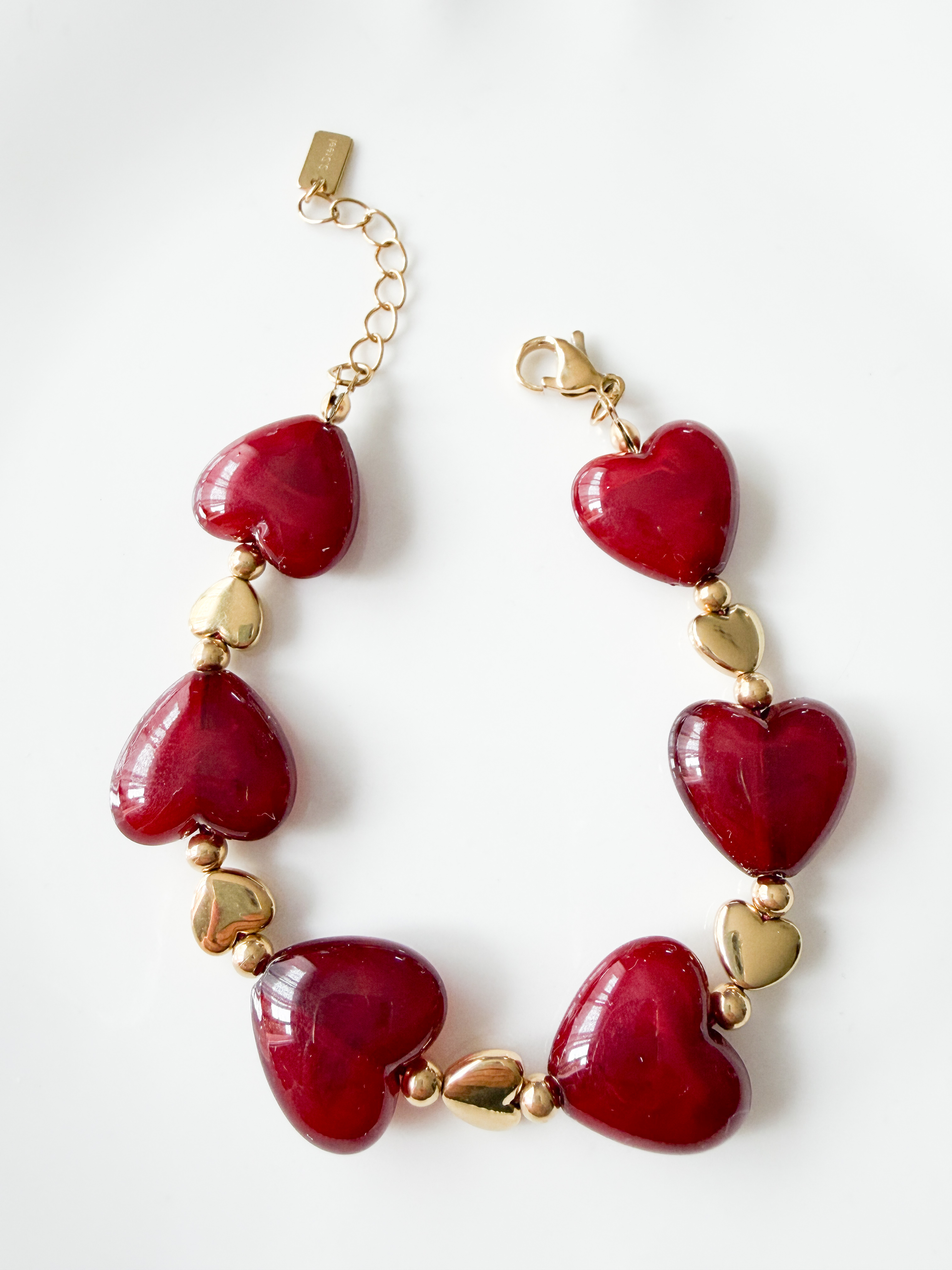 Bracelet coeurs bordeaux doré