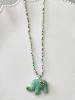 Collier éléphant pierres turquoise doré