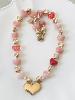 Collier coeur perles roses doré