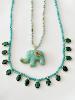 Collier éléphant pierres turquoise doré