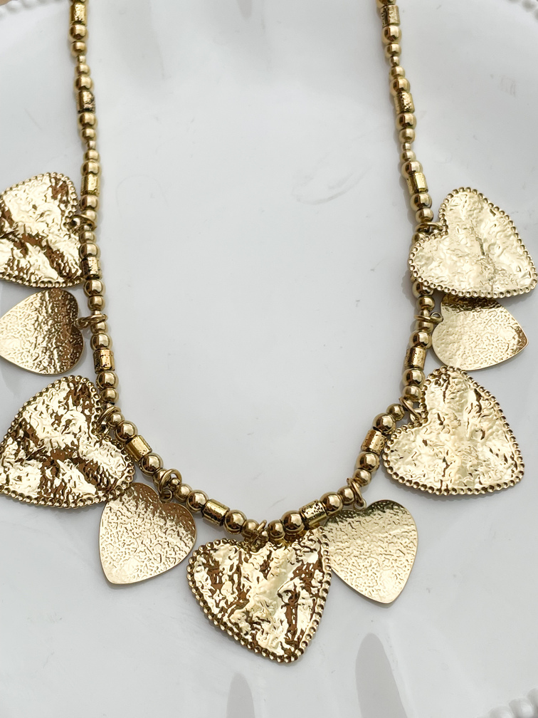 Collier coeurs breloques gravés doré
