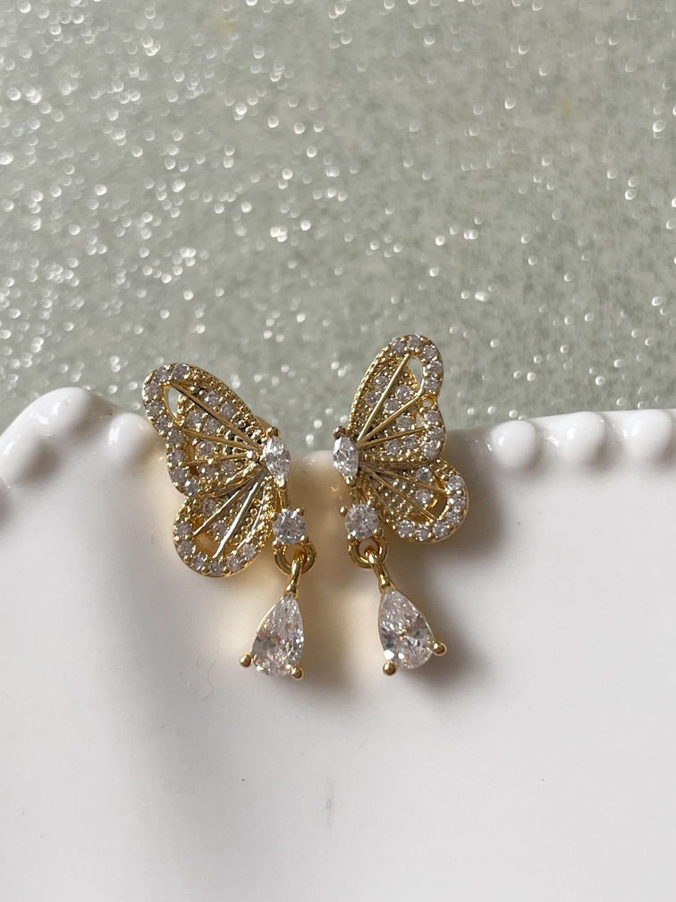 Boucles papillon doré