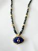 Collier pierres oeil bleu doré