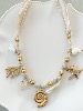 collier coquillage doré