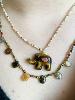 Collier éléphant pierres marron doré